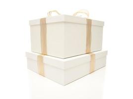 Stacked White Gift Boxes with Gold Ribbon Isolated photo