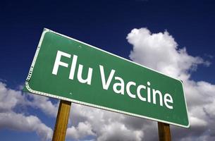 Flu Vaccine Green Road Sign photo