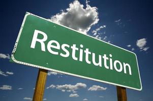 Restitution Road Sign photo