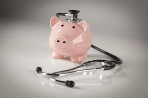 Piggy Bank and Stethoscope with Selective Focus photo