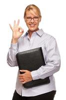 Attractive Blond Businesswoman with Okay Hand Sign on White photo