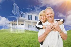 Senior Couple In Front of Ghosted House Drawing on Grass photo