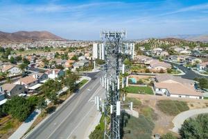 Close-up Aerial of Cellular Wireless Mobile Data Tower with Neighborhood Surrounding photo