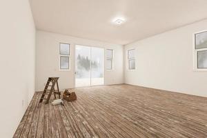 escalera y equipo de pintura en una habitación sin terminar de la casa con paredes blancas en blanco y suelos de madera gastados. foto