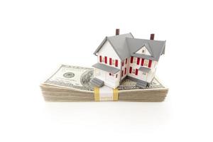 Small House on Stack of Hundred Dollar Bills photo