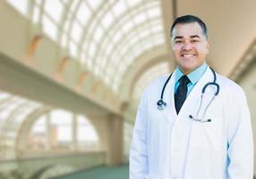 Handsome Hispanic Male Doctor or Nurse Inside Hospital Building photo