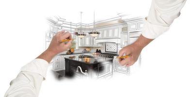 Two Male Hands Sketching Custom Kitchen with Photo Showing Through