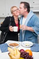 Businesswoman with Husband In Kitchen photo