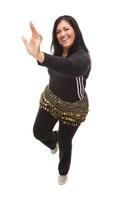 Attractive Hispanic Woman Dancing Zumba on White photo