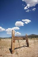 Aged Fence and Clouds photo