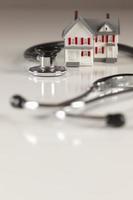 Stethoscope with Small Model Home photo