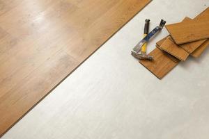 Hammer and Pry Bar with Laminate Flooring Abstract photo