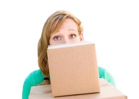 Happy Young Adult Woman Holding Moving Boxes Isolated On A White Background. photo