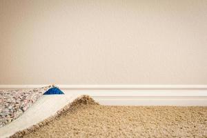 Pulled Back Carpet and Padding In Room photo