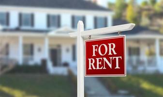 For Rent Real Estate Sign In Front of Beautiful House photo