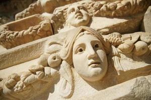 Ancient Mask Relief in Aphrodisias Ancient City in Aydin, Turkiye photo