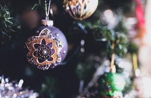 Christmas ornaments bauble on tree with blurry light background, Xmas ball on the branches fir,Horizontal banner for Merry Christmas,Happy New Year greeting card, Noel, Winter Holidays Concept photo
