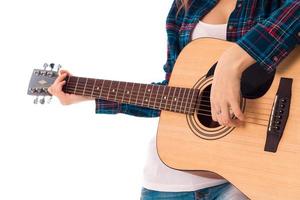 female playing guitar in studio photo