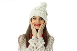 brunette girl in warm sweater and red scarf photo