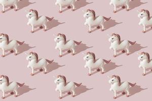 Simple and cute unicorn pattern. Pastel pink color tones. Minimal composition. photo