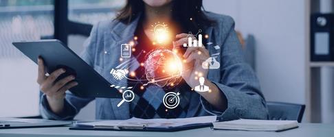 woman Hand holding virtual Global Internet connection metaverse. Business global internet connection application technology and digital marketing, Financial and banking, Digital link tech, big data. photo