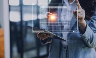 Analyst working with computer in Business Analytics and Data Management System to make report with KPI and metrics connected to database. Corporate strategy for finance, operations, sales, marketing photo
