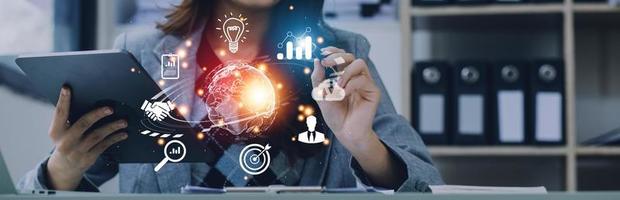 woman Hand holding virtual Global Internet connection metaverse. Business global internet connection application technology and digital marketing, Financial and banking, Digital link tech, big data. photo