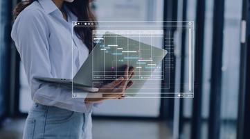 Analyst working with computer in Business Analytics and Data Management System to make report with KPI and metrics connected to database. Corporate strategy for finance, operations, sales, marketing photo