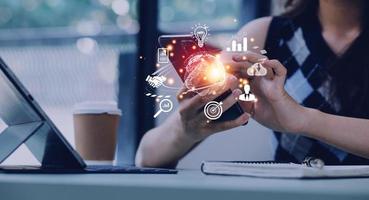 woman Hand holding virtual Global Internet connection metaverse. Business global internet connection application technology and digital marketing, Financial and banking, Digital link tech, big data. photo