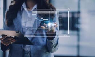 Analyst working with computer in Business Analytics and Data Management System to make report with KPI and metrics connected to database. Corporate strategy for finance, operations, sales, marketing photo