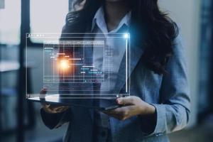 Analyst working with computer in Business Analytics and Data Management System to make report with KPI and metrics connected to database. Corporate strategy for finance, operations, sales, marketing photo