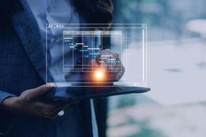 Analyst working with computer in Business Analytics and Data Management System to make report with KPI and metrics connected to database. Corporate strategy for finance, operations, sales, marketing photo