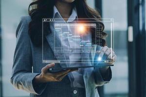 Analyst working with computer in Business Analytics and Data Management System to make report with KPI and metrics connected to database. Corporate strategy for finance, operations, sales, marketing photo