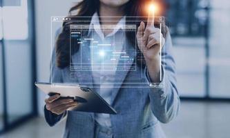 Analyst working with computer in Business Analytics and Data Management System to make report with KPI and metrics connected to database. Corporate strategy for finance, operations, sales, marketing photo