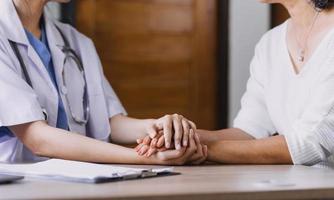 Homecare nursing service and elderly people cardiology healthcare. Close up of young hispanic female doctor nurse check mature caucasian man patient heartbeat using stethoscope during visit photo