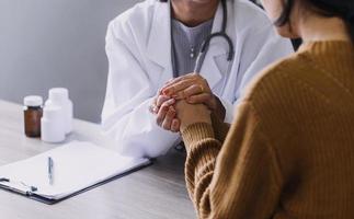 Homecare nursing service and elderly people cardiology healthcare. Close up of young hispanic female doctor nurse check mature caucasian man patient heartbeat using stethoscope during visit photo