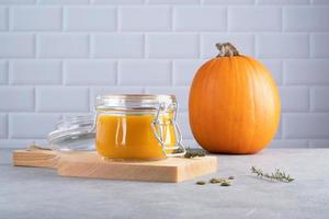 Pumpkin puree soup with pumpkin seeds and thyme