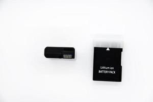 Lithium rechargeable battery from the camera. Battery for the device on a white background. Analog and original of the battery. photo