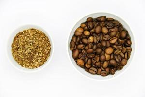 Toasted coffee beans in a porcelain cup. Coffee mixture. Delicious coffee beans and freeze-dried. photo