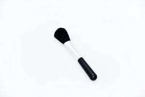 Black brush for cleaning optics. A small brush on a white background. A cleaning brush. photo