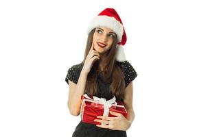 charming brunette woman in santa hat photo