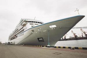 a large sea passenger liner is moored in the port. photo