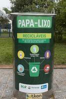 Brasilia, Brazil, December 21 2022 The New Sotkon Waste System to collect trash recently installed in Brasilia, the Green Containers indicate Plastic and Paper Trash photo