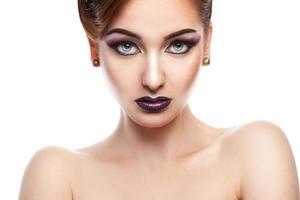 Horizontal portrait of cute female with make up in studio photo