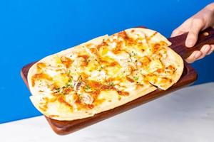 tart flambe seafood pizza on wood board photo