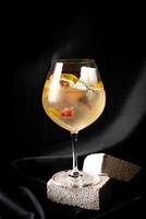 cocktail - white wine, tequila, triple,aromatic bitter, orange bitter, lime juice, syrup, topping with jelly and marshmello and mixed fruits photo