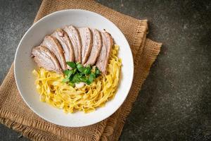 dried duck noodles in white bowl photo