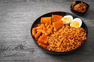 Korean instant noodles with Korean rice cake and fish cake and boiled egg photo