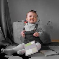 Cutie little baby girl smiles at home photo