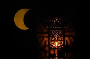 Lantern with moon shape from light on background for the Muslim feast of the holy month of Ramadan Kareem. photo